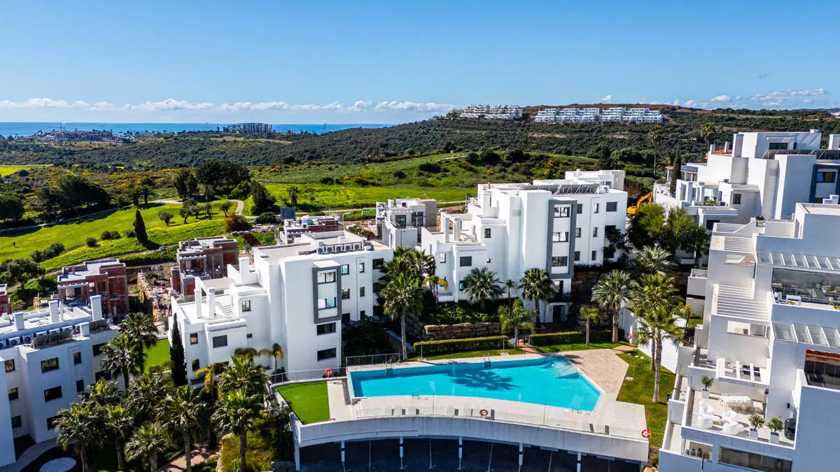 Aerial view of the development, apartment in Estepona, with the sea beyond